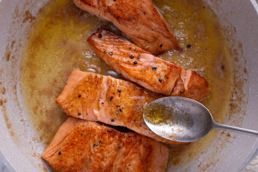 pan fried salmon making sauce