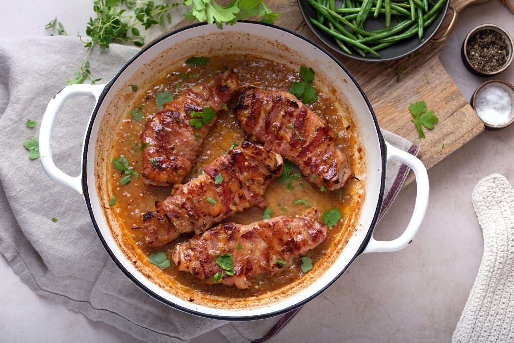 Placing pork chops in oven to broil