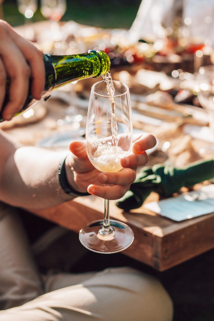 man pouring champagne