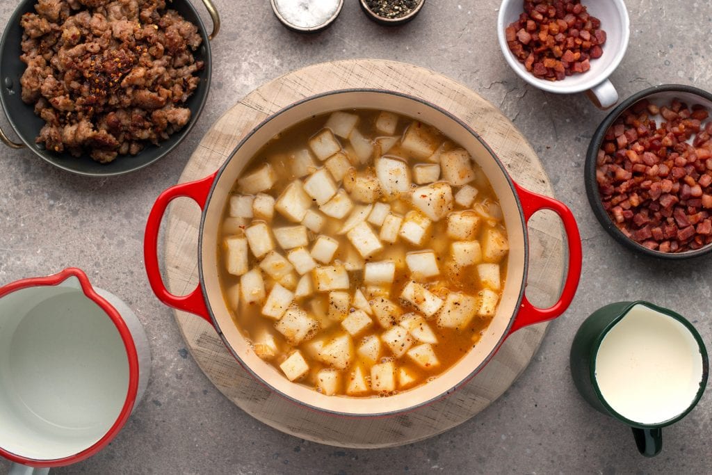 adding chicken broth